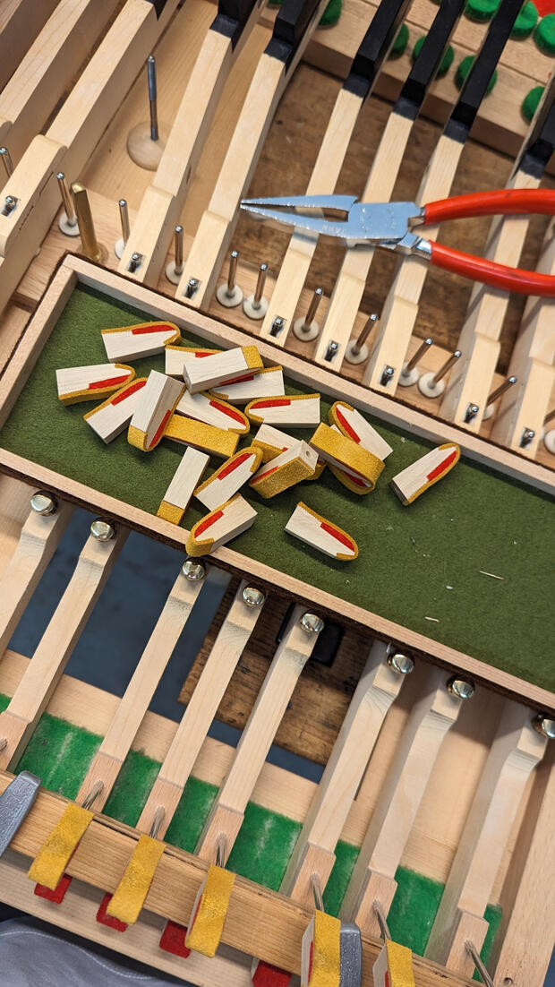 Steinway backcheck replacement installs premium leather and felt to ensure precise hammer catching after every strike. This essential piano action restoration restores the high-speed repetition and professional feel of a Steinway & Sons piano.