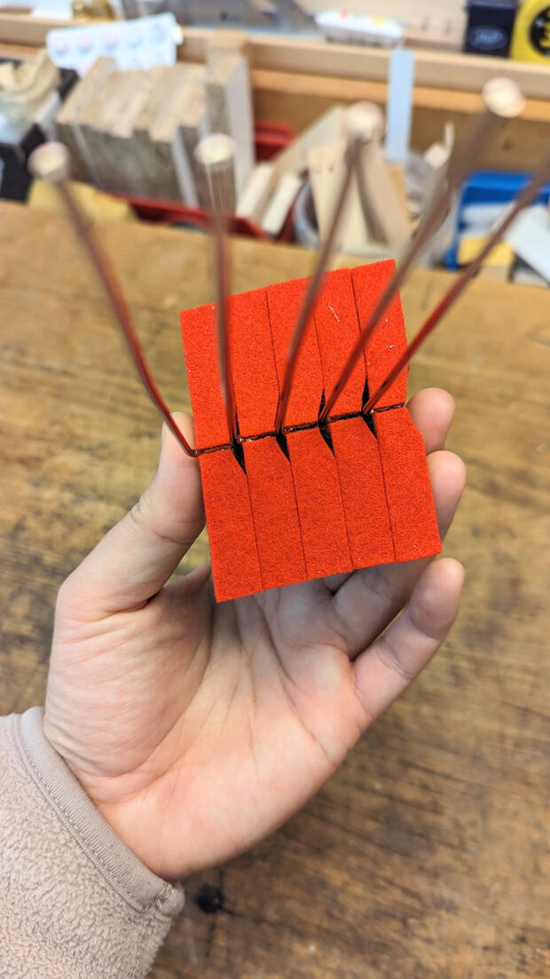 Steinway damper felt renewal installs premium red underfelt for silent string termination and a period-correct appearance. This ensures the performance and visual standards of a Steinway & Sons piano.