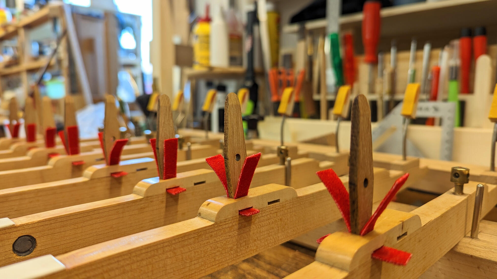 Steinway key rebushing replaces worn felt in the balance and front rail holes with premium cloth to eliminate key wobble. This essential piano action restoration ensures a quiet, stable, and professional keyboard touch for any Steinway & Sons piano.