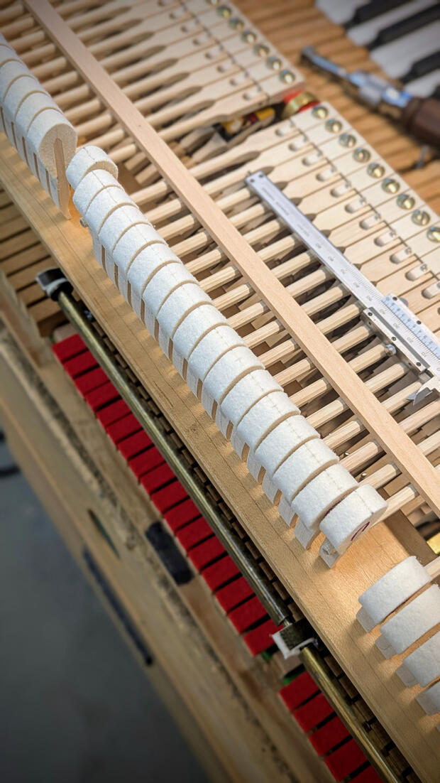 Steinway hammer striking point optimization involves precisely adjusting the hammer's contact position on the string to unlock maximum tonal power and clarity. This step ensures every note achieves the signature projection and richness of Steinway sound.